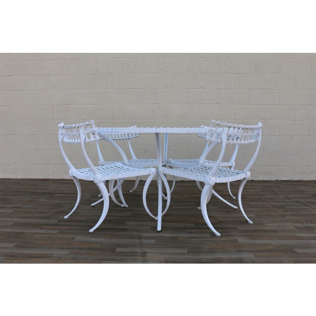 Spectacular vintage Thinline aluminum Klismos-style outdoor dining set, circa 1960s. A beautiful example of California...