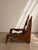 Handcrafted lounge chair by OSSO Furniture Studio, featuring a sculptural solid wood frame paired with a natural cowhide...