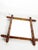 Decorative French wooden wall mirror dating from the 1930s, featuring an elegant architectural frame inspired by turned...