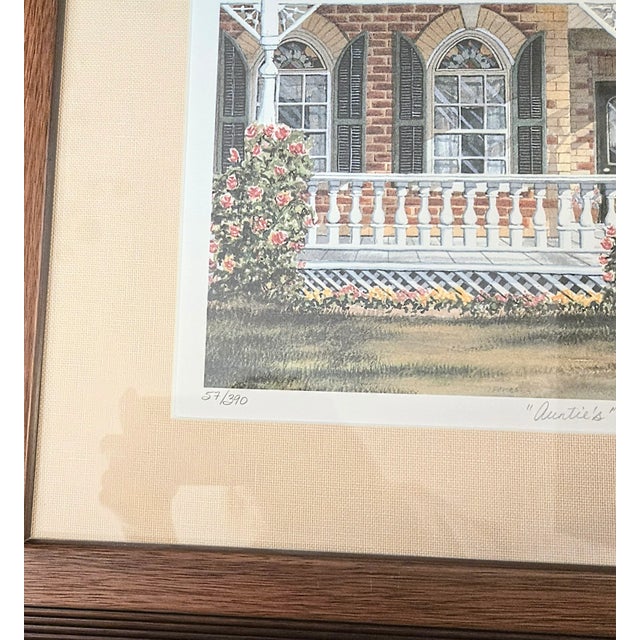This is a numbered matted, framed print of a watercolor. The subject of "Auntie's" is an intensely detailed front porch -...