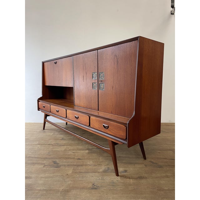 Designed by louis van teeffelen for webe in the netherlands, this mid-century highboard is a masterclass in functional...