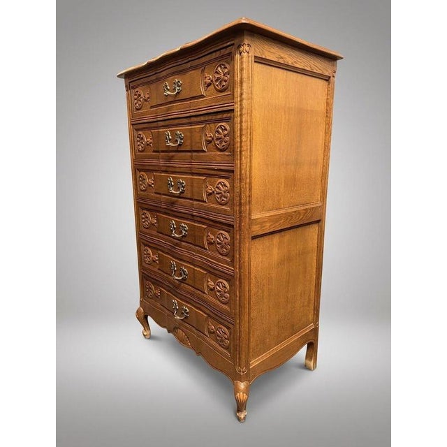 Exquisitely crafted in the timeless Louis XV tradition, this carved oak French tallboy offers an elegant blend of classic...