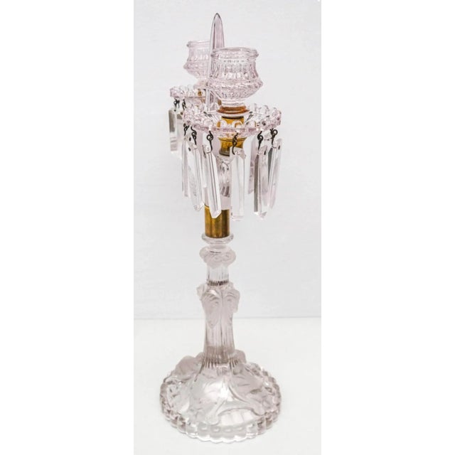 French dual armed crystal candelabra. With frosted glass chimera faces at base. Rams heads at base and fluted and pointed...