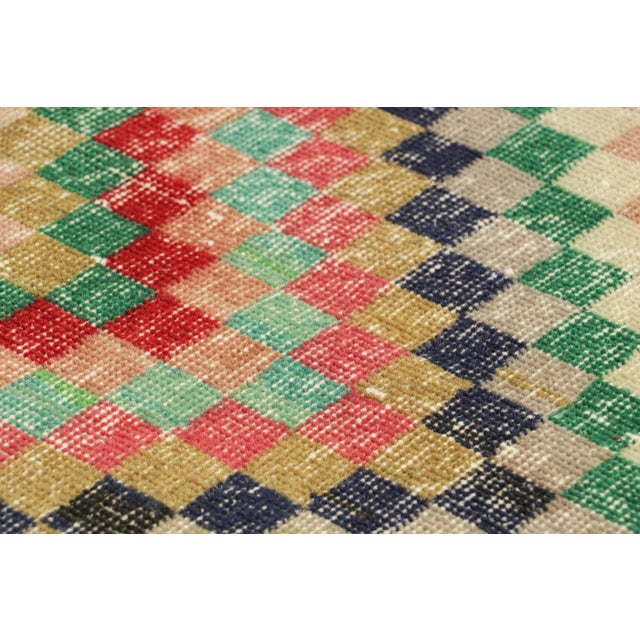Hand-knotted in wool and originating from Turkey circa 1960 – 1970, this 2x4 vintage Zeki Müren rug is a unique addition...