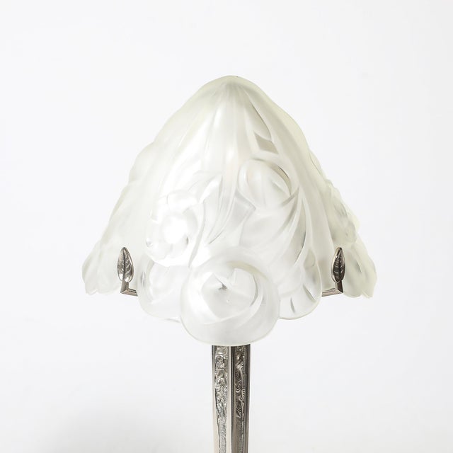 This elegant Art Deco-style table lamp from France, dating to the 20th century, exemplifies the timeless sophistication of...