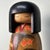 Decorative Sosaku Kokeshi with a stylish kimono. Dimensions: height 22 cm, diameter 10 cm. The kimono is adorned with...