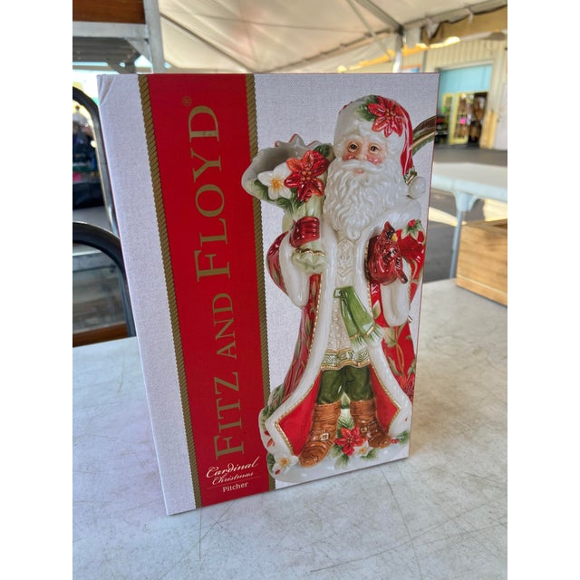 Vintage Fitz and Floyd Cardinal Holiday Santa Pitcher, also known as the Noel Holiday Santa Pitcher. It is made of hand-...