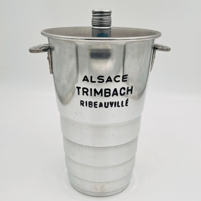 Vintage Vogalu French wine cooler or champagne chiller or ice bucket is crafted of aluminum and engraved "Alsace Trimbach...