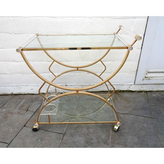 Large Gilded Brass, Glass and Acrylic Glass Bar Cart, 1970s, in Good conditions. Designed 1970 to 1979