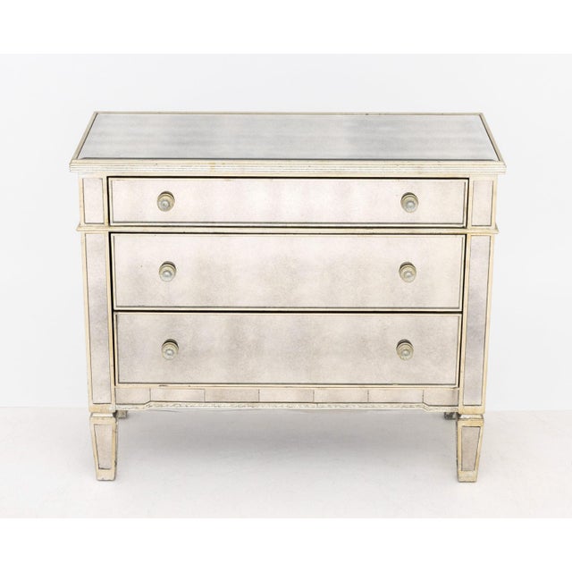 Art Deco Style Mirrored and Silvered Wood Chest of Drawers, three frieze drawers with silver-tone hardware. 35.5" H x...
