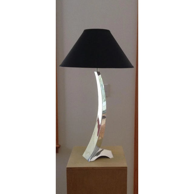 This lamp is made from welded stainless steel sheet and is polished to a high degree of reflectivity and is signed. The...