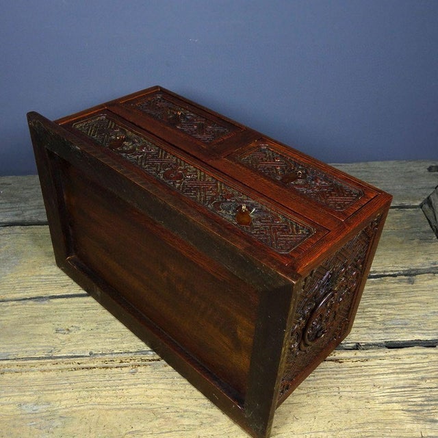 This is a magnificent vintage Chinese Huali (Rosewood) tabletop chest, meticulously hand-carved with deep relief motifs....