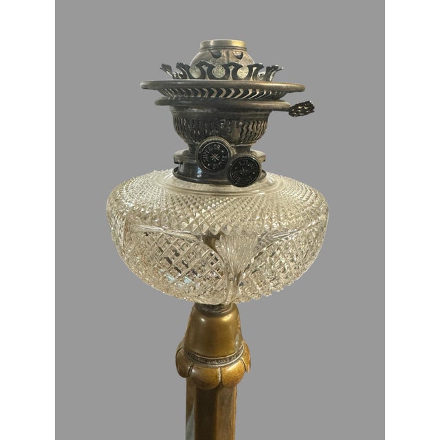 Impressive antique Victorian oil lamp attributed to Palmer & Co., retaining its ornate period burner assembly and...