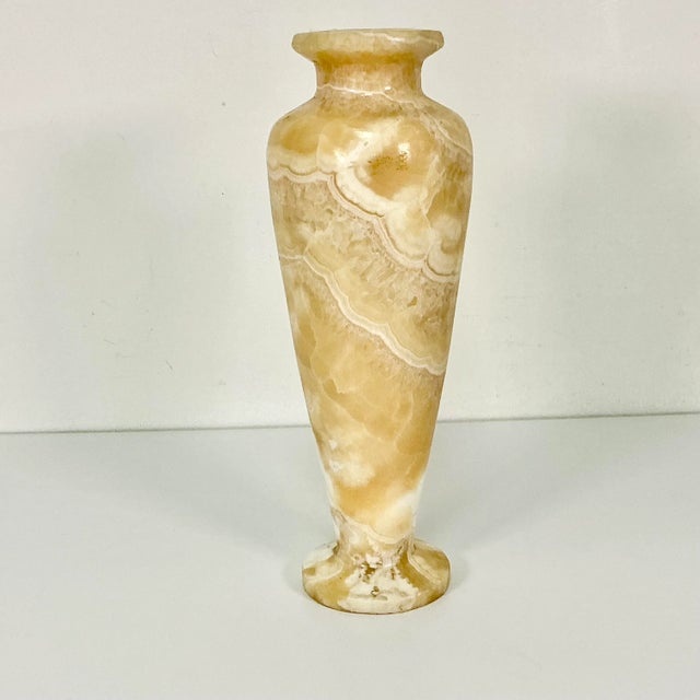 This is a lovely statement vase hand carved from a gorgeous camel-colored piece of Italian marble. The detailed marble...