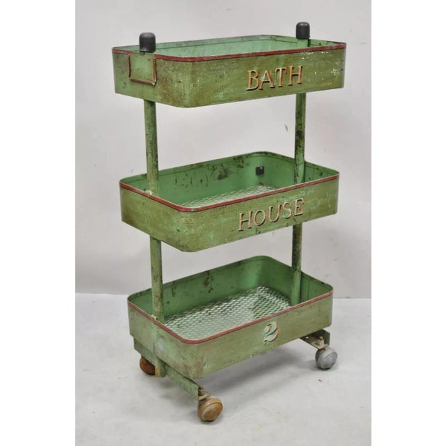 Antique "Bath House 2" Green Painted Metal 3 Tier Rolling Bathroom Trolley Cart. Item features rolling casters, original...