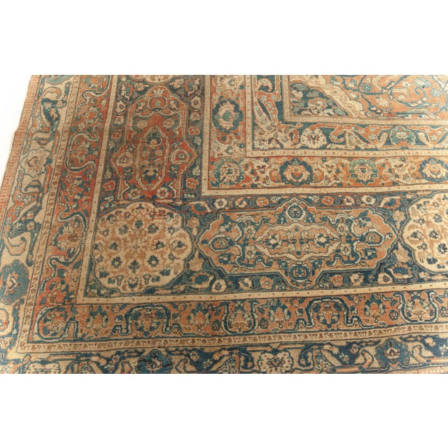 This majestic oversized antique Tabriz rug from the late 19th century exemplifies the artistic and technical mastery for...