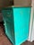 Crafted in Romania from solid knotty pine, this vintage cabinet showcases the rustic character and craftsmanship of...