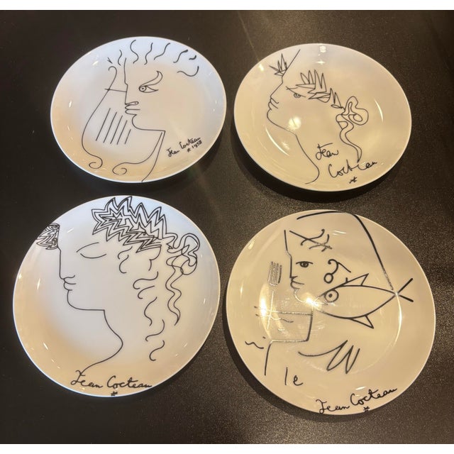 This is a set of 4 plates produced in Limoges, France, and designed by the renowned Jean Cocteau. Each plate features a...