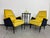 Yellow mid-century design armchairs after professional renovation.