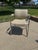 Striking vintage chair featuring a polished chrome tubular frame and original neutral textured upholstery. This piece...