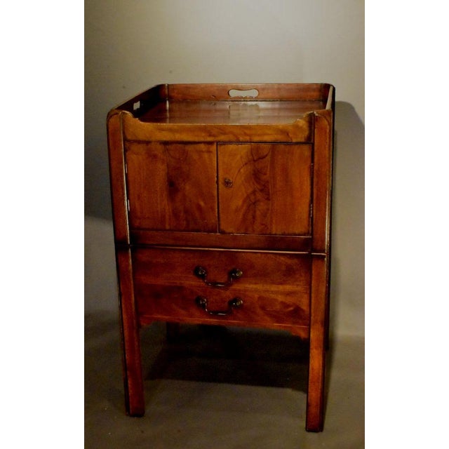 Mahogany George III commode In the Chippendale style, late 1700s. This one again has a gallery top with cut out handles...