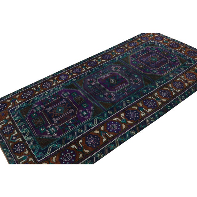 Hand Knotted in wool, this rare vintage 5x9 Oushak runner rug from the rare series of mid-century runners, features...