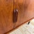 Vintage Teak Sideboard with Retracting Doors – Mid-Century Scandinavian Design This teak sideboard with sliding doors is a...