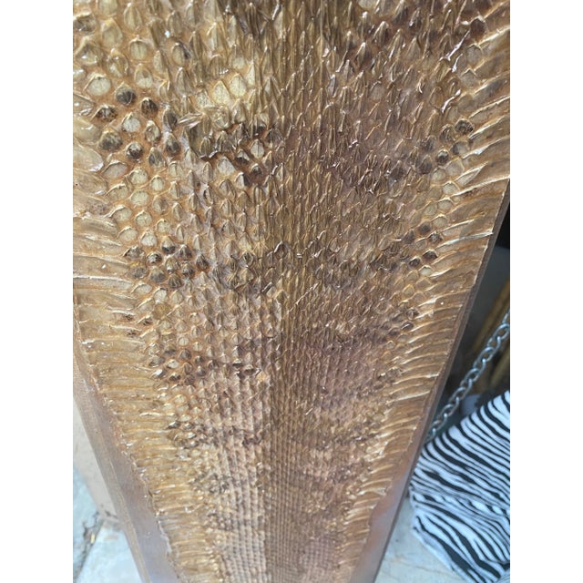 A beautiful snake skin on a wooden plank. Perfect for the interior designer or the enthusiast!