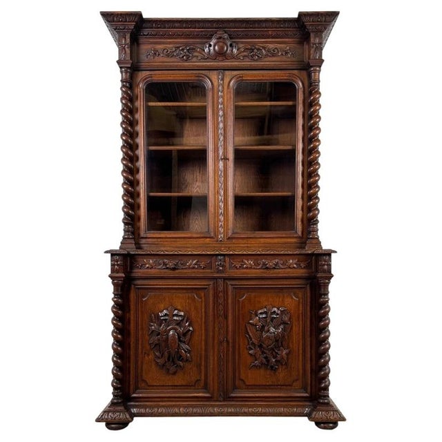 A magnificent 19th-century Renaissance Revival bookcase, substantially constructed from solid oak and distinguished by its...