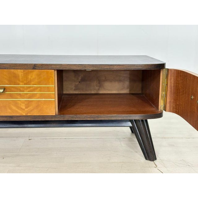 For sale is a stylish vintage lowboard from the 1960s, in well-maintained condition. A particular highlight is the...