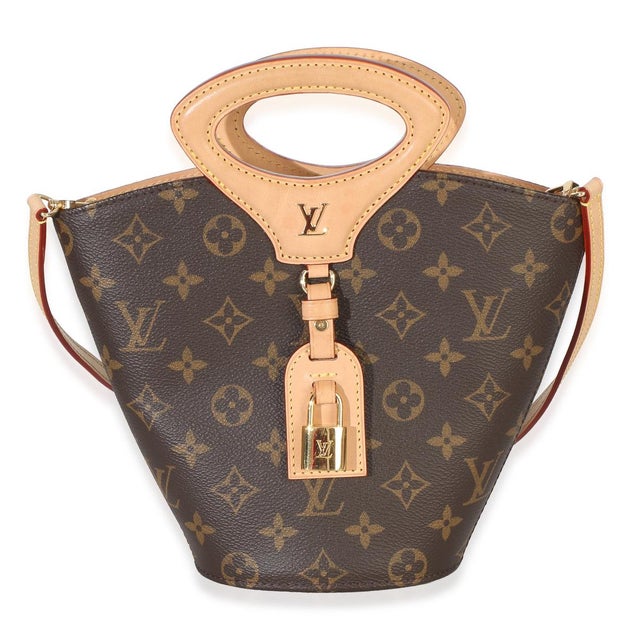 Item #: 154880 Interior Material: Canvas MSRP: 4,050 Features Interior: Single zip pocket Dimensions: 10 x 7.75 x 3 in...