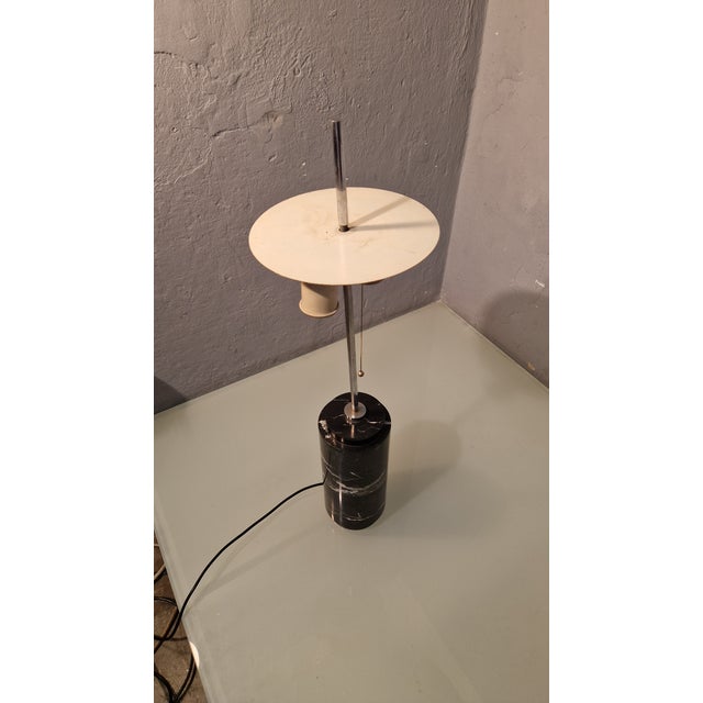 Table Lamp in Black Marquinia Marble from Knoll, 1970s, in Very Good conditions. Designed 1970 to 1979 This piece is...