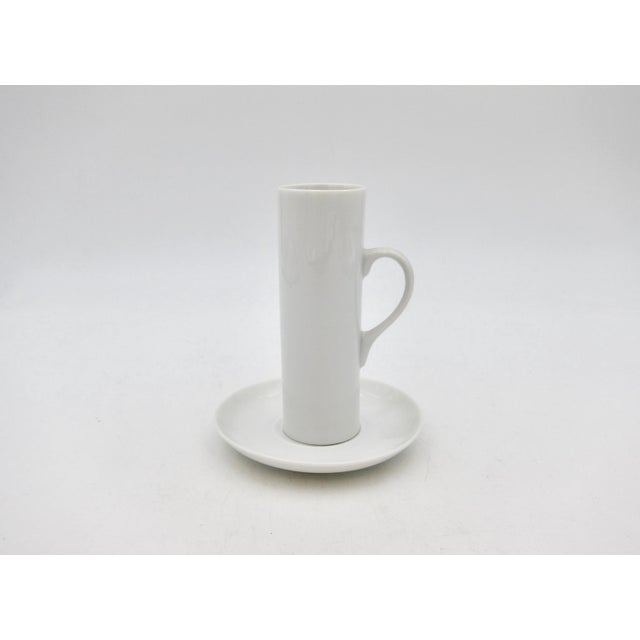 A mid-century set of espresso / demitasse cups and saucers designed by Lagardo Tackett for Schmid in crisp white...