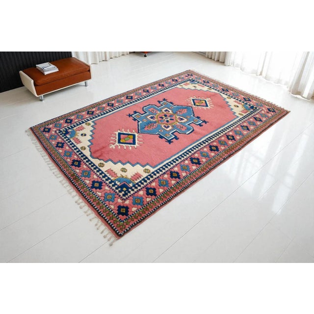 This is a remarkable example of vintage textile artistry, an authentic Central Anatolian rug hand-knotted from 100% pure...