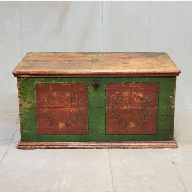 A gorgeous rustic Eastern European pine blanket chest with original deep green and brick red paint, likely from the Czech...