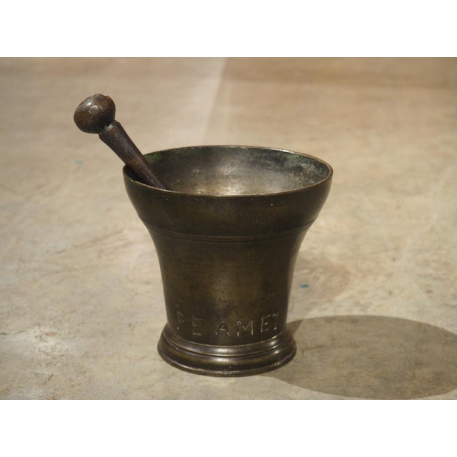 Mortars, such as this bell-shaped bronze one from the 1700s, were used in kitchens of grand chateaux in France. They could...