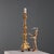 This carved and gilded wooden candelabra from Italy in the late 19th century exemplifies the decorative craftsmanship of...