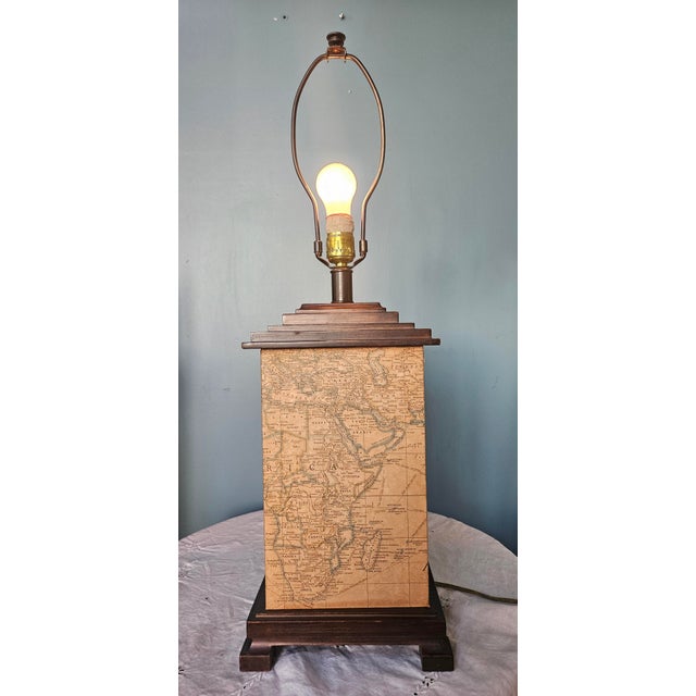 Beautiful example of Frederick Cooper original design. World map mounted around the lamp, framed top and bottom by richly...