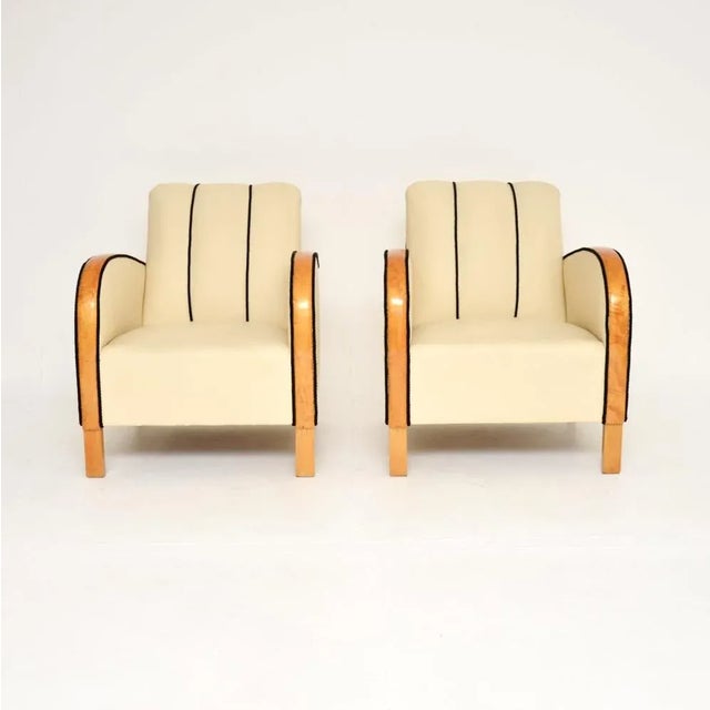 A stylish and very well made pair of Swedish Art Deco armchairs in leather and satin birch. They were recently imported...