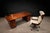A structurally confident Brazilian Modern desk attributed to Geraldo de Barros, executed in solid rosewood and veneer with...