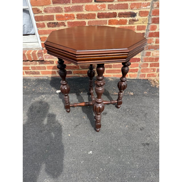 Vintage Victorian Renaissance Style Octagonal Table Solid wood frame, well carved ,raised on 4 turned legs , connected by...