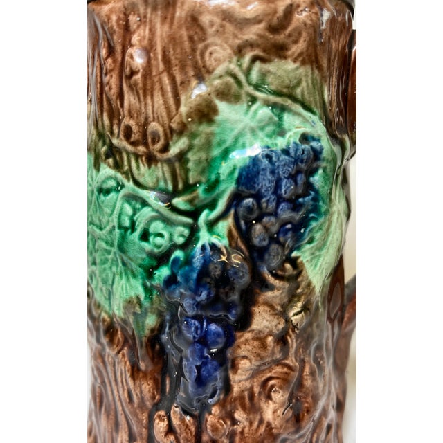 Antique 19th Century Majolica Pitcher /Jug With Pewter Top Decorated With a Vibrant Grape & Vine Pattern Against a Brown Tree-Like Textured Background For Sale - Image 11 of 11