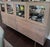Beautiful Hudson buffet storage cabinet with steel base. Wood maple with shell stain, stainless steel base and stainless...