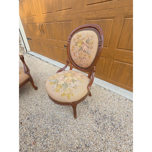 Antique circa 1900 parlor chair with later needlepoint tapestry upholstery.