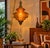 Large Vintage Amber Glass Swag Pendant Light A striking oversized vintage swag pendant featuring beautifully molded amber...