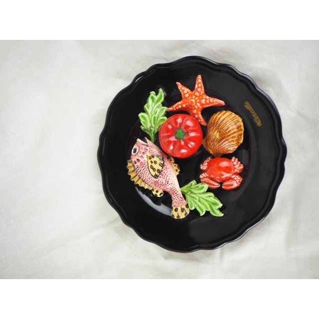 French Majolica Trompe l'Oeil Fish Decorative Wall Plate, Vallauris, circa 1950. Scorpion fish, starfish, tomato, crab,...