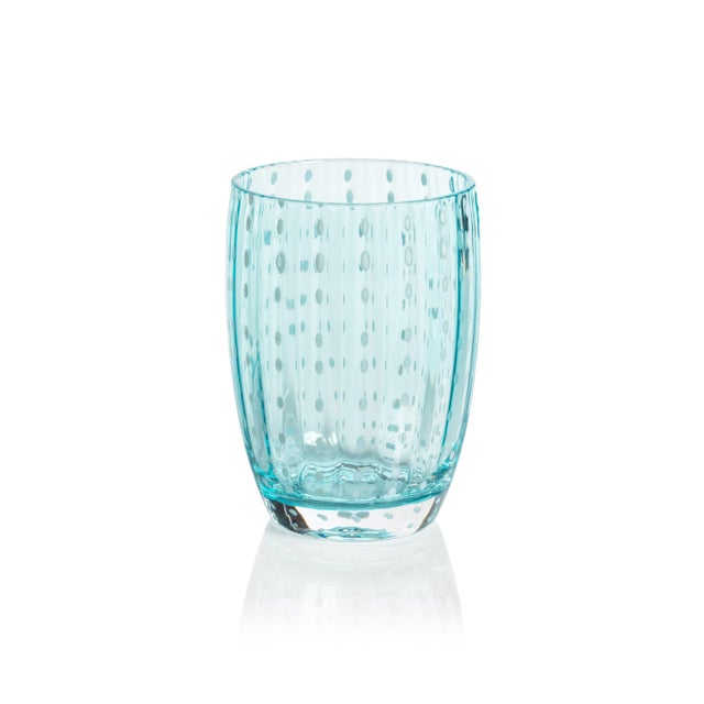 Elevate your table setting with this stunning blue glassware collection, featuring elegant dotted patterns and sleek...