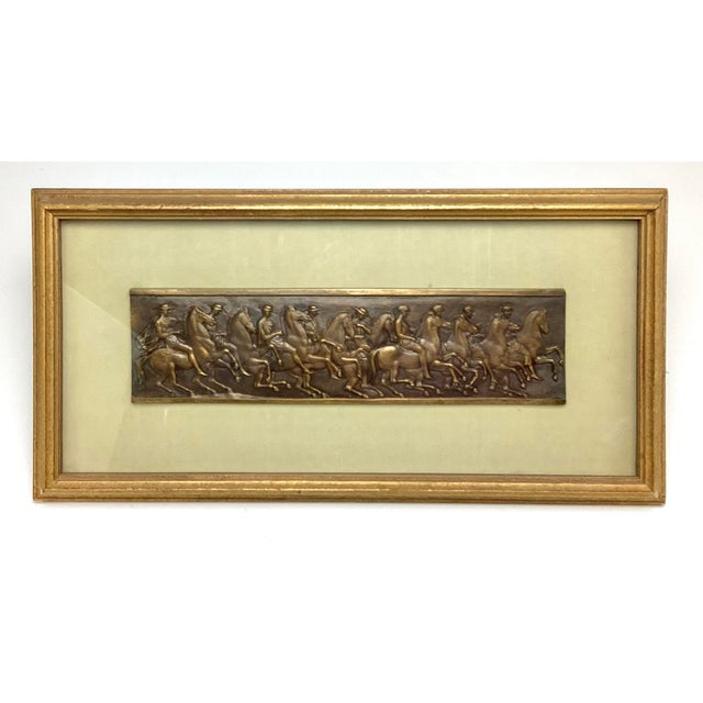 Beautifully Framed Bronze Fragment of Men on Horseback A striking bronze fragment depicting men on horseback, presented in...