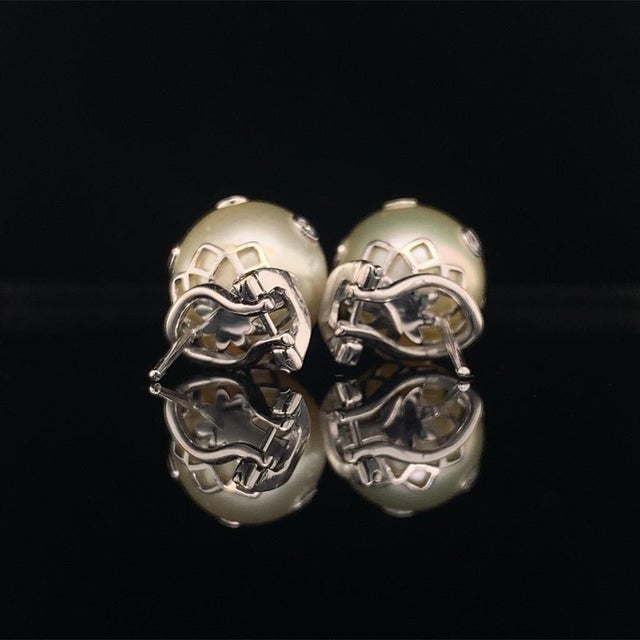 Quality South Sea Golden Pearl Earrings set with diamonds throughout the pearl in 14 KT Certified $4,995 015793 Nothing...