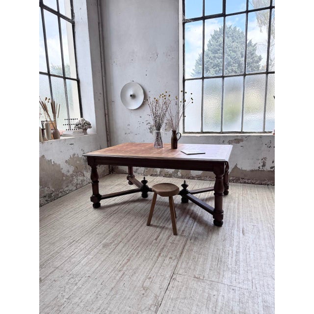 Antique louis xiv style oak and walnut table, dating from the 1900s. we love the remarkable craftsmanship of the base. The...